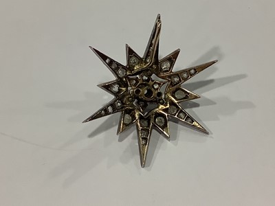 Lot 149 - A Victorian diamond star brooch/pendant.