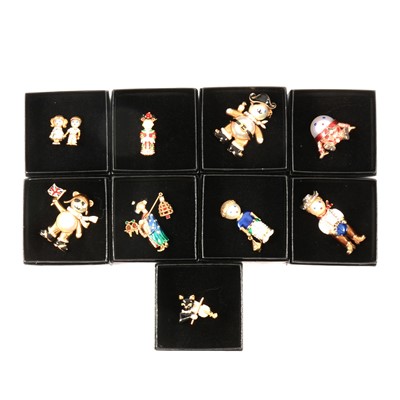 Lot 342 - Butler & Wilson - nine novelty enamel brooches with pearlised detail, black boxed circa 1990,s