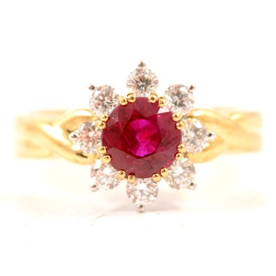 Lot 350 - A ruby and diamond circular cluster ring.