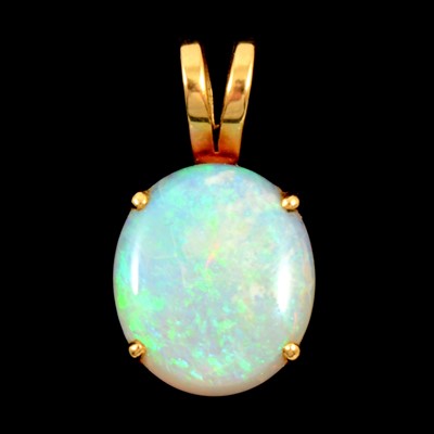 Lot 214 - An oval cabochon cut opal pendant.