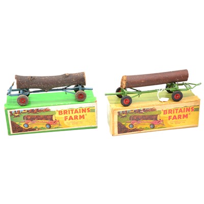 Lot 334 - Two Britains Farm toys, no.129F timber trailers with logs, boxed