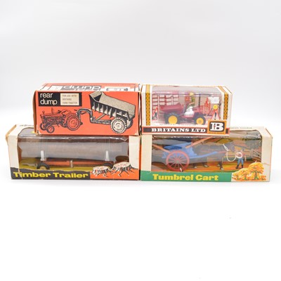 Lot 305 - Four Britains Farm toys including ref 9559 timber trailer, all boxed.