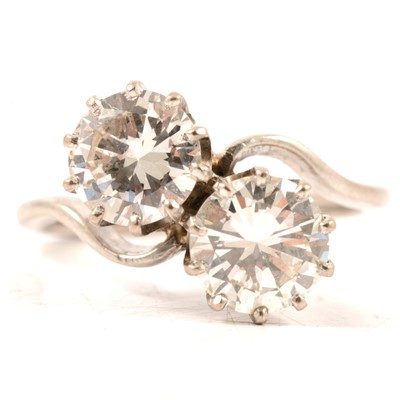 Lot 11 - A diamond two stone crossover ring.