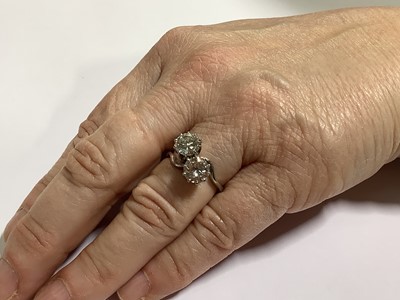 Lot 11 - A diamond two stone crossover ring.