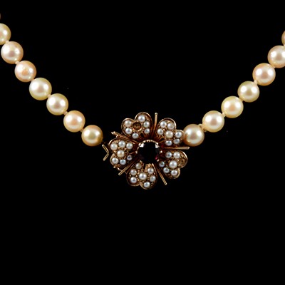 Lot 371 - A cultured pearl necklace with garnet clasp.