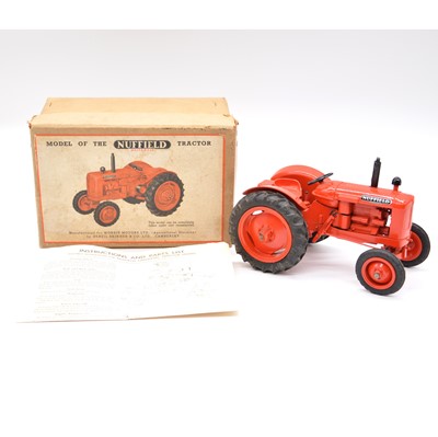 Lot 346 - Denzil Skinner & Co model Nuffield Universal tractor, red body, boxed with instructions.