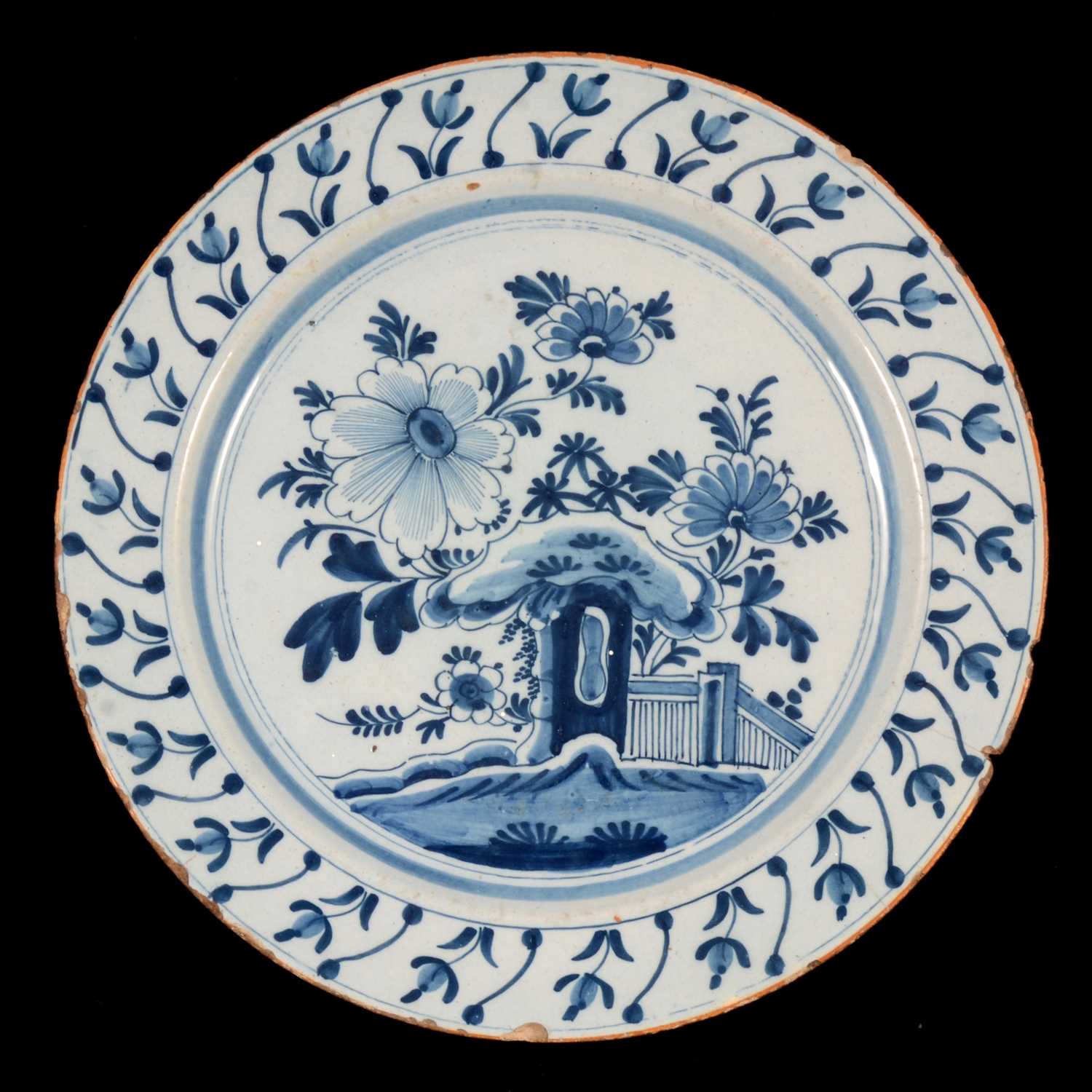 Lot 6 - An English delft blue and white charger