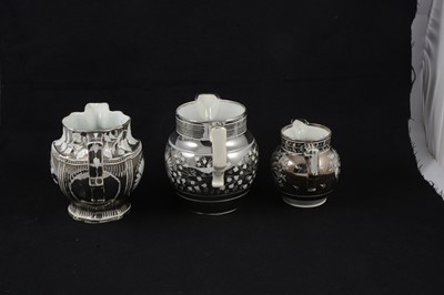 Lot 57 - A collection of seven silver lustre jugs