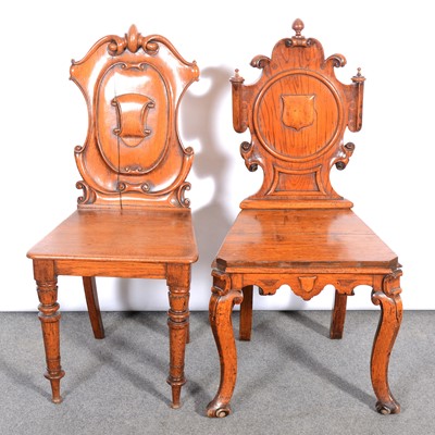 Lot 592 - Two Victorian oak hall chairs