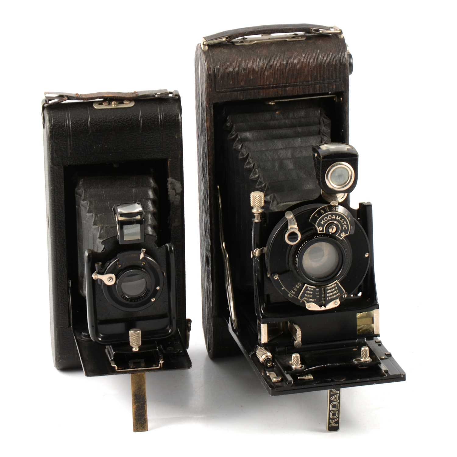 Lot 107 - Nine vintage folding cameras, all by Kodak, two with red bellows.