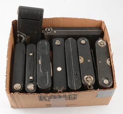 Lot 107 - Nine vintage folding cameras, all by Kodak, two with red bellows.