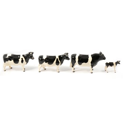 Lot 21 - Set of three Beswick Fresian models, and one other cow