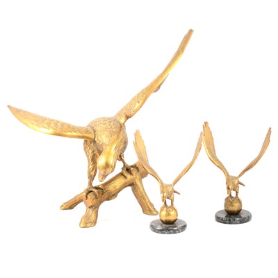 Lot 152 - Three cast brass eagles, one large two small.