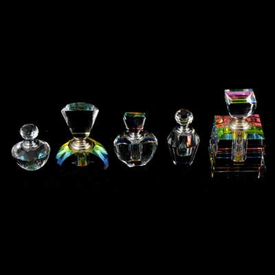 Lot 65 - Five iridescent cut glass scent bottles.