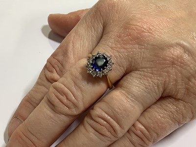 Lot 46 - A sapphire and diamond cluster ring