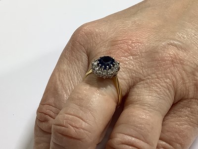 Lot 46 - A sapphire and diamond cluster ring