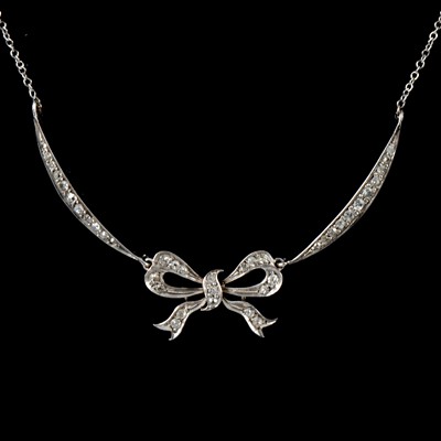 Lot 208 - A diamond bow design necklace.