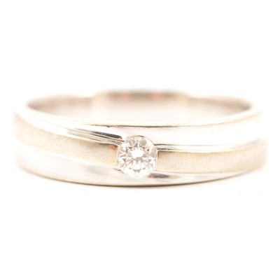 Lot 32 - A modern diamond solitaire ring.