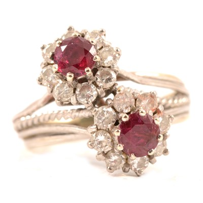 Lot 69 - A ruby and diamond double cluster ring.