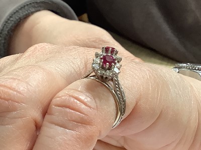 Lot 69 - A ruby and diamond double cluster ring.
