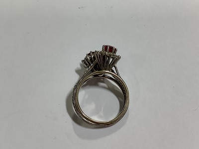 Lot 69 - A ruby and diamond double cluster ring.