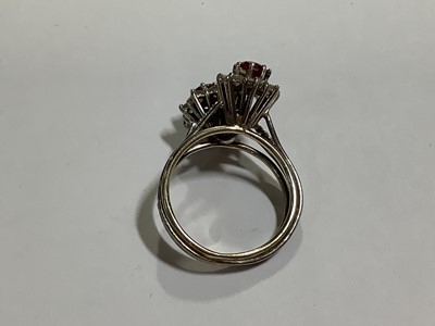 Lot 69 - A ruby and diamond double cluster ring.