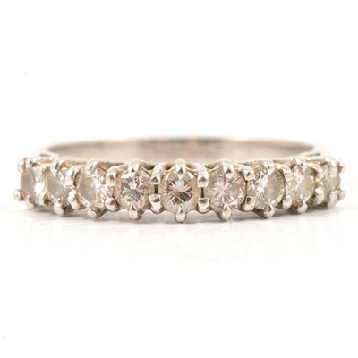 Lot 29 - A diamond half eternity ring.