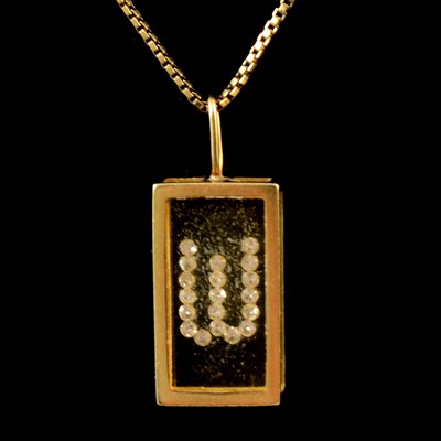 Lot 226 - A "W" pendant and chain.