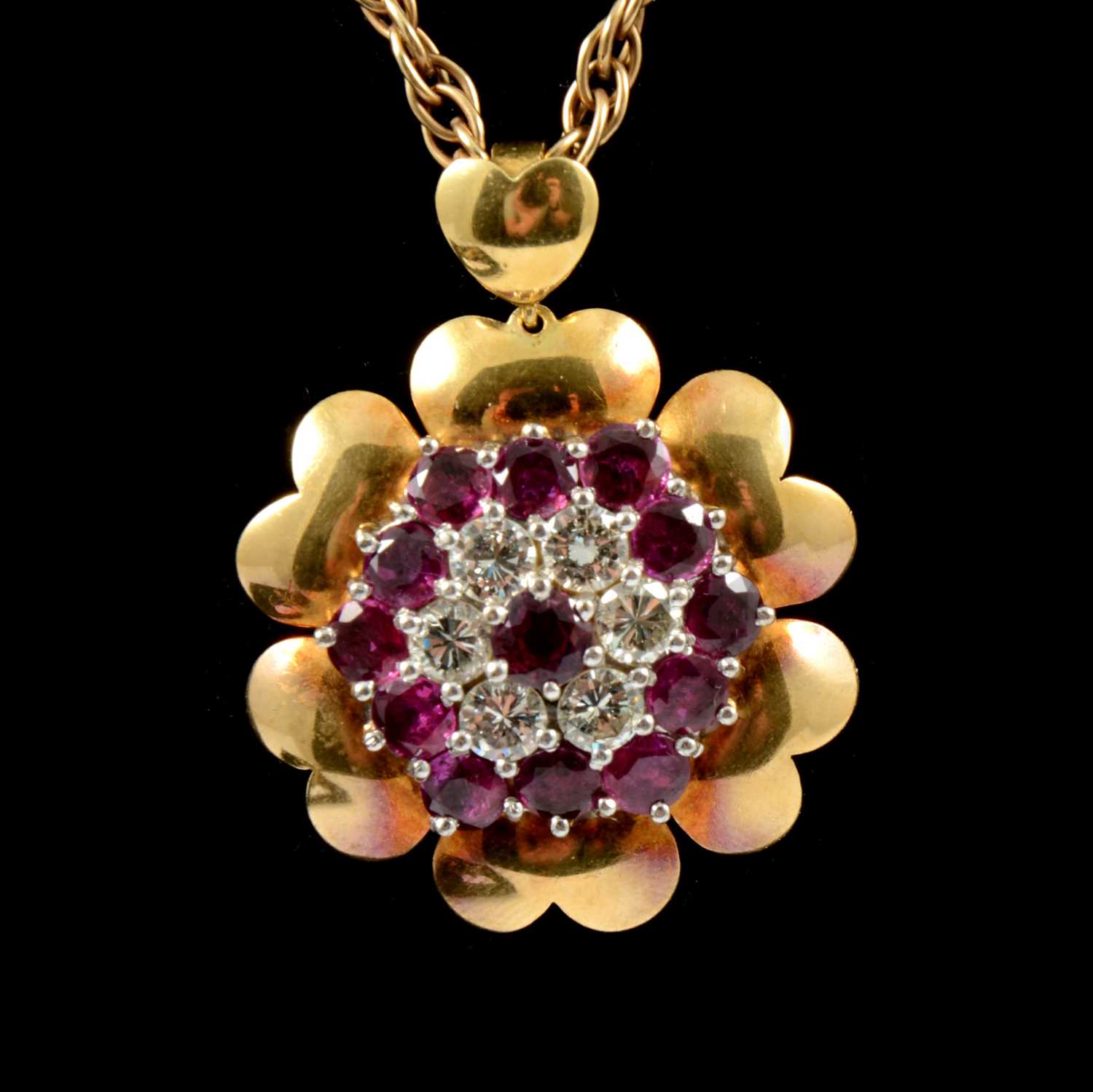 Lot 204 - A large ruby and diamond cluster pendant and chain.