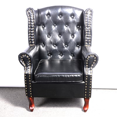 Lot 598 - Wing back easy chair, simulated leather buttoned upholstery