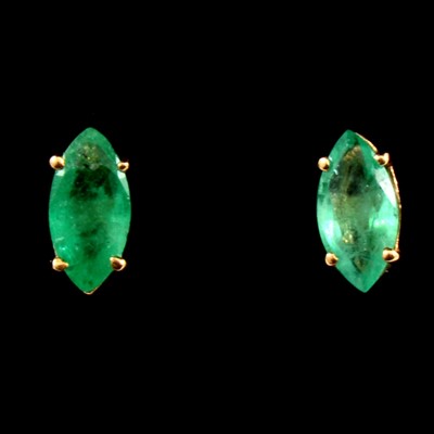 Lot 140 - A pair of emerald marquise cut earstuds
