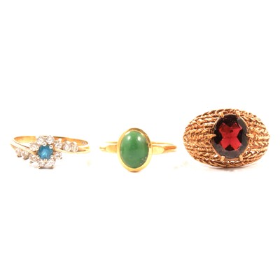 Lot 82 - Three gemset rings, green stone garnet and synthetic stone cluster.
