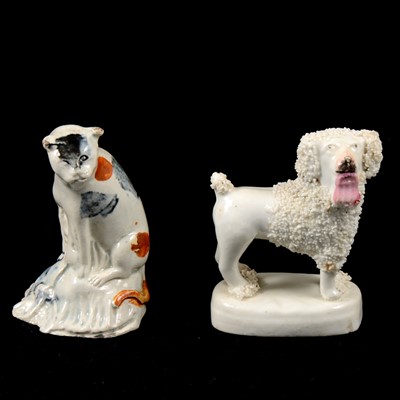 Lot 47 - An early Prattware cat and Staffordshire poodle.