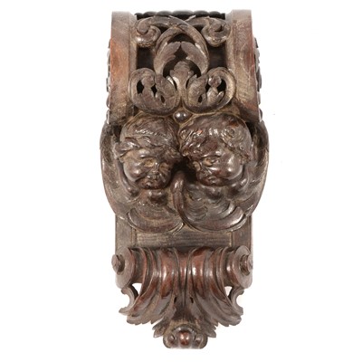Lot 159 - Carved wooden corbel with cherub masks