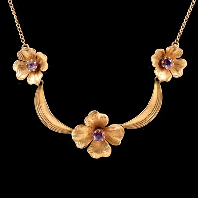 Lot 207 - A 9 carat gold floral swag necklace set with amethyst.