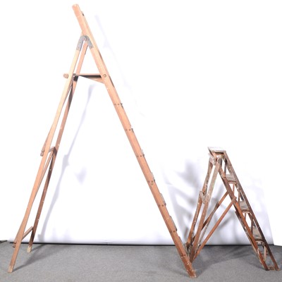 Lot 612 - Two sets of vintage folding ladders.