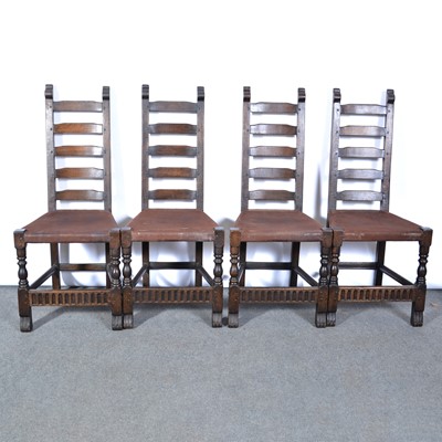 Lot 521 - Refectory type reproduction carved oak trestle dining table and six chairs