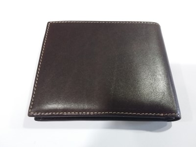 Lot 397 - Patek Philippe Geneve- a brown leather wallet, as new boxed.