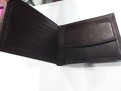 Lot 397 - Patek Philippe Geneve- a brown leather wallet, as new boxed.