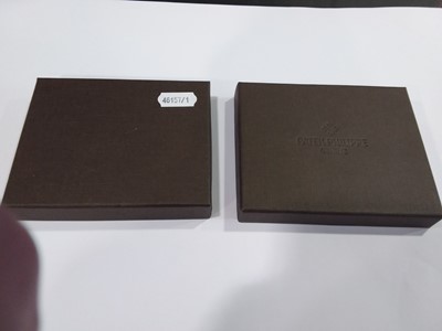 Lot 397 - Patek Philippe Geneve- a brown leather wallet, as new boxed.