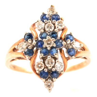 Lot 348 - A sapphire and diamond cluster ring.