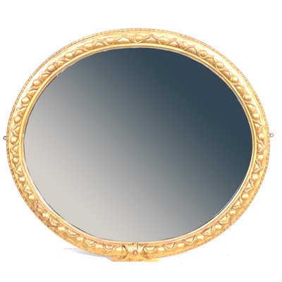 Lot 373 - Oval gilt gesso wall mirror