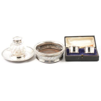 Lot 256 - Georgian silver bottle coaster, a silver and glass inkstand,and  pair of napkin rings