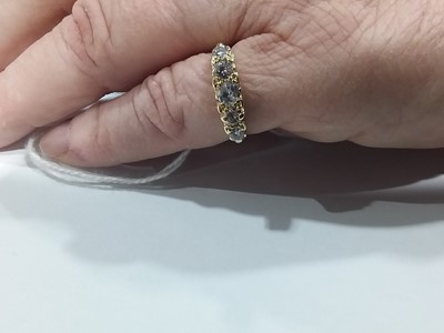 Lot 19 - A diamond five stone ring.