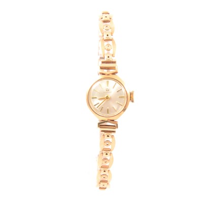 Lot 329 - Tissot - a lady's 9 carat yellow gold bracelet watch.