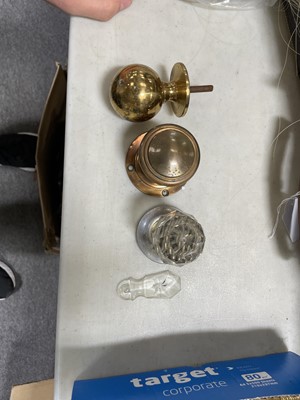 Lot 186 - A collection of brass and crystal doorknobs and fittings, crystal escutcheon covers, glass door plates.