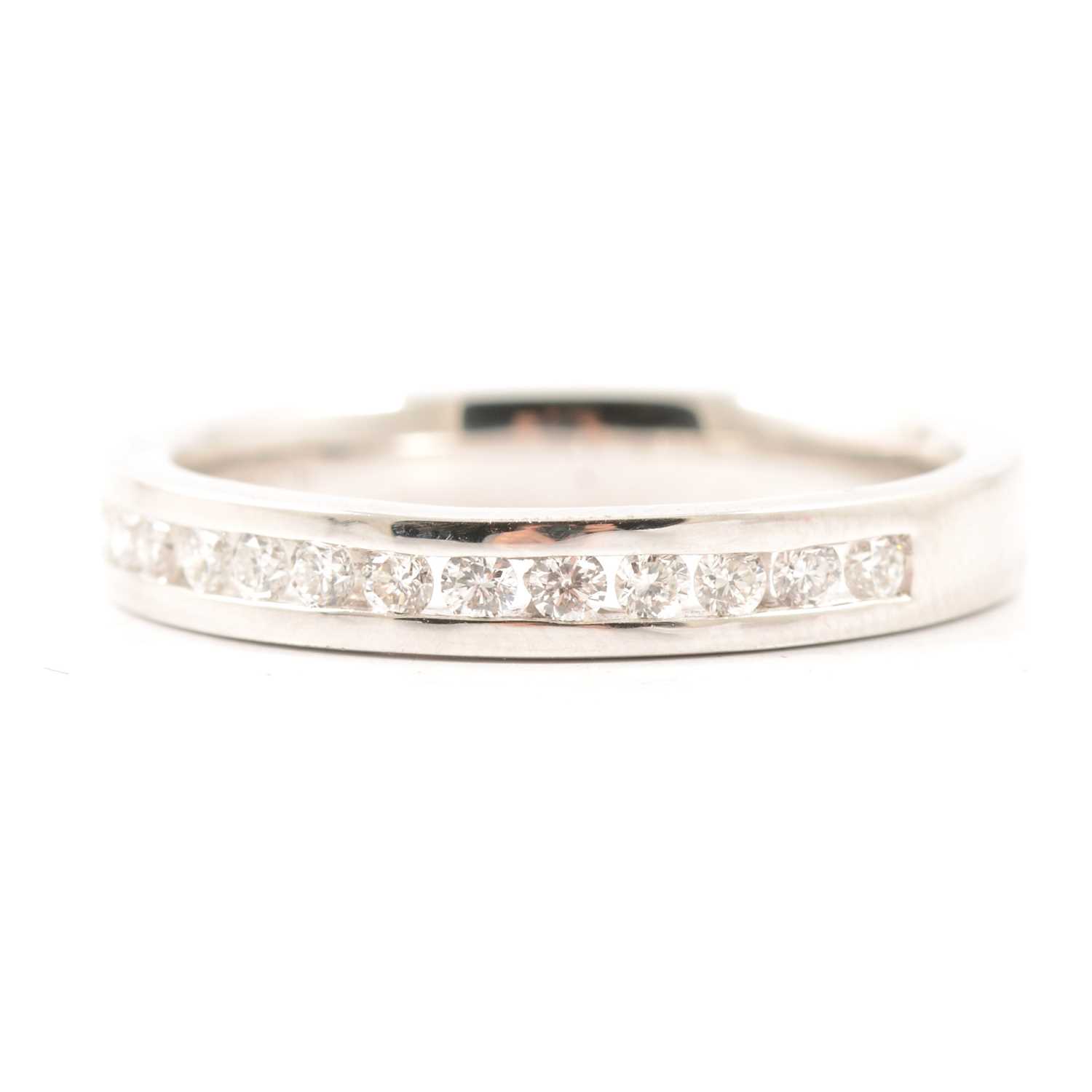 Lot 31 - A diamond half eternity ring.
