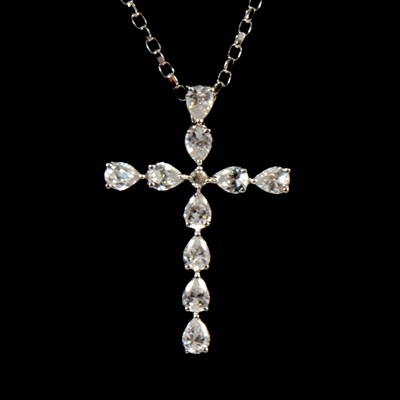 Lot 274 - A white gold cubic zirconia cross and chain.