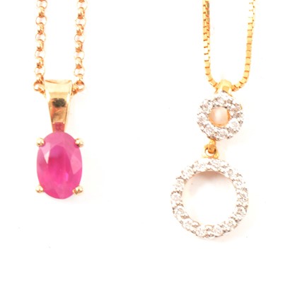 Lot 210 - A diamond pendant and a ruby pendant.