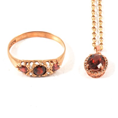 Lot 352 - Two garnet pendants and two garnet dress rings.